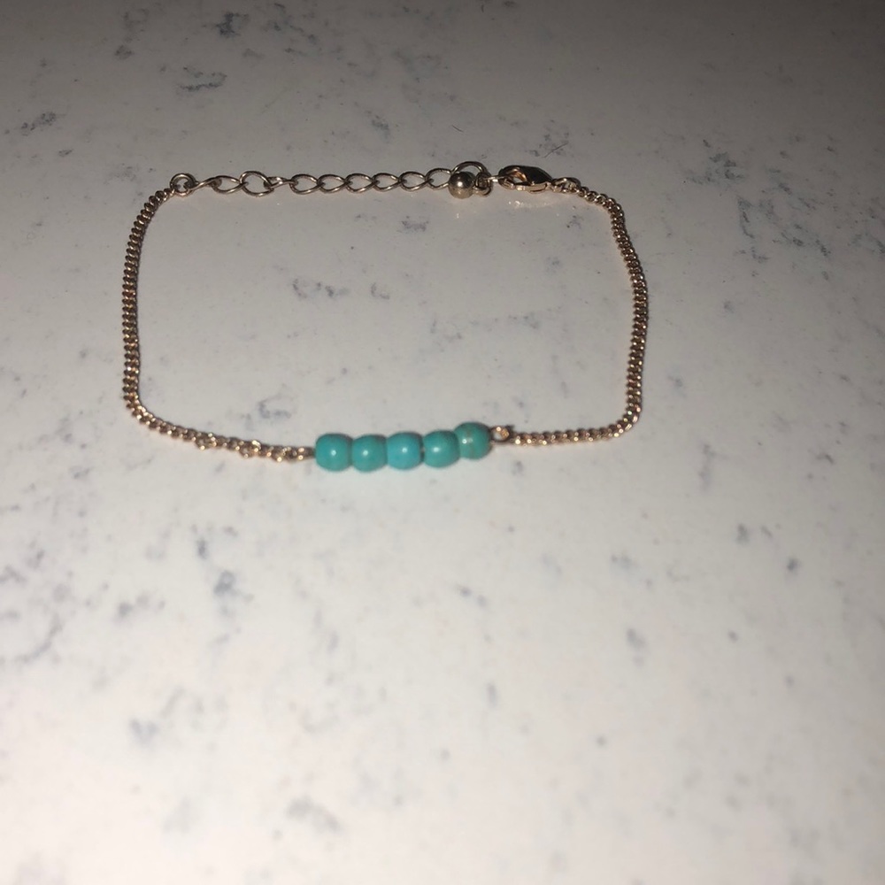 Turquoise ball and gold chain bracelet